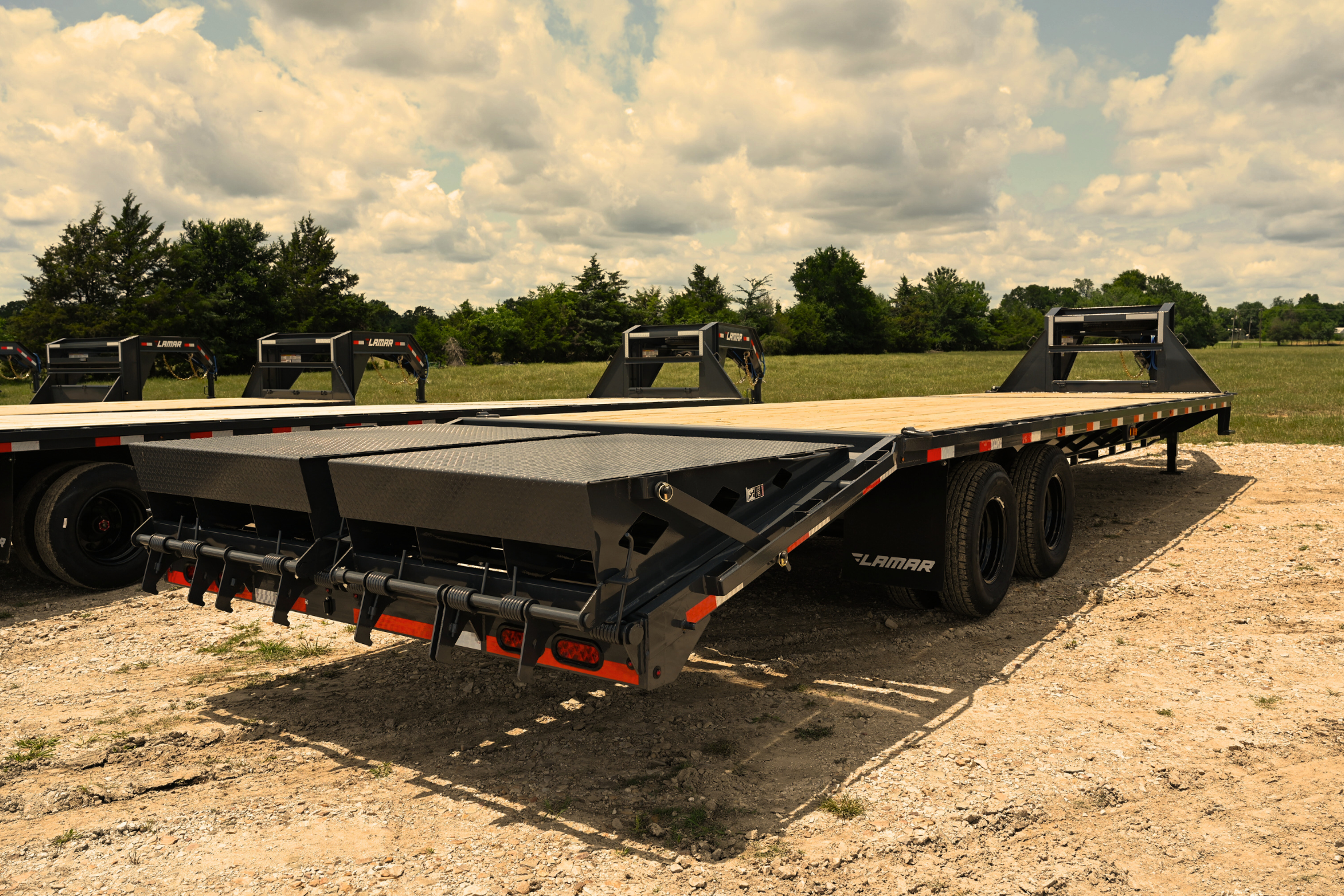 Lamar FD Extreme Duty Deckover gooseneck trailer with wood floor